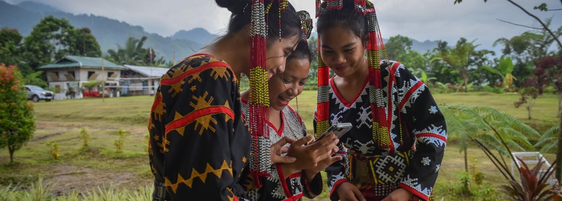 T'boli students use their mobile phones. Photo credit: ADB.